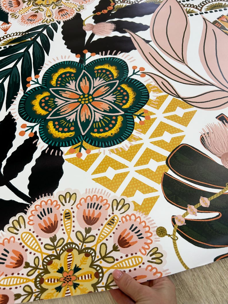 A white fridge wrap pattern of pink, green, yellow, and black floral designs. The pattern features stylized flowers, leaves, and geometric shapes.