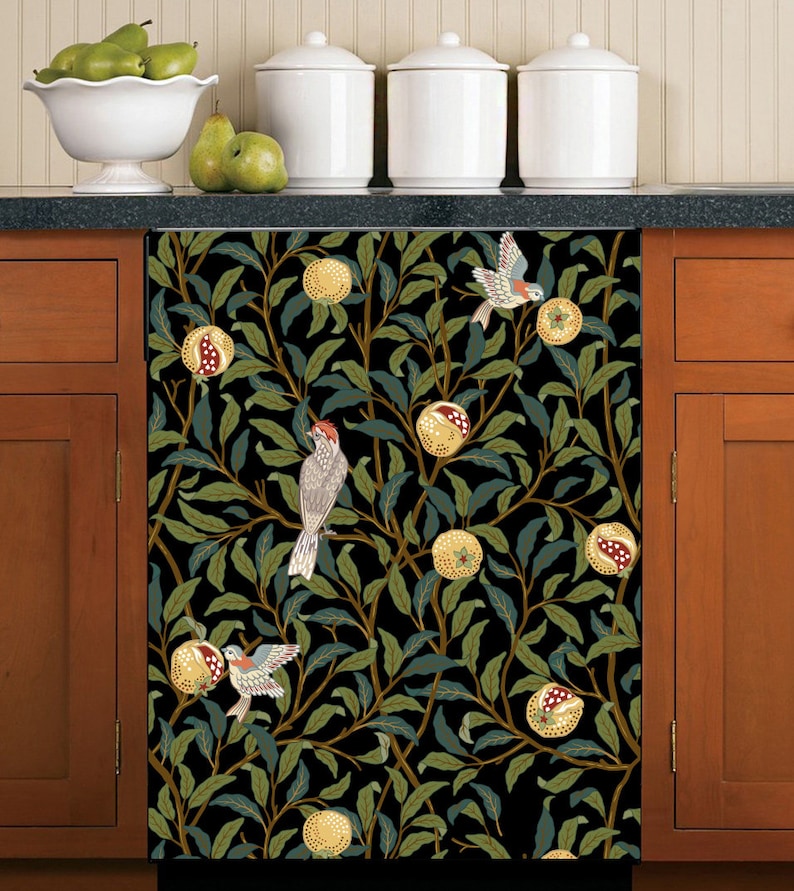May include: A black and green dishwasher magnet with a repeating pattern of pomegranates, leaves, and birds. The birds are brown, red, and white.