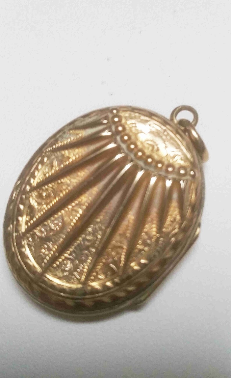 pattern on both sides Antique 9 carat gold sunburst locket