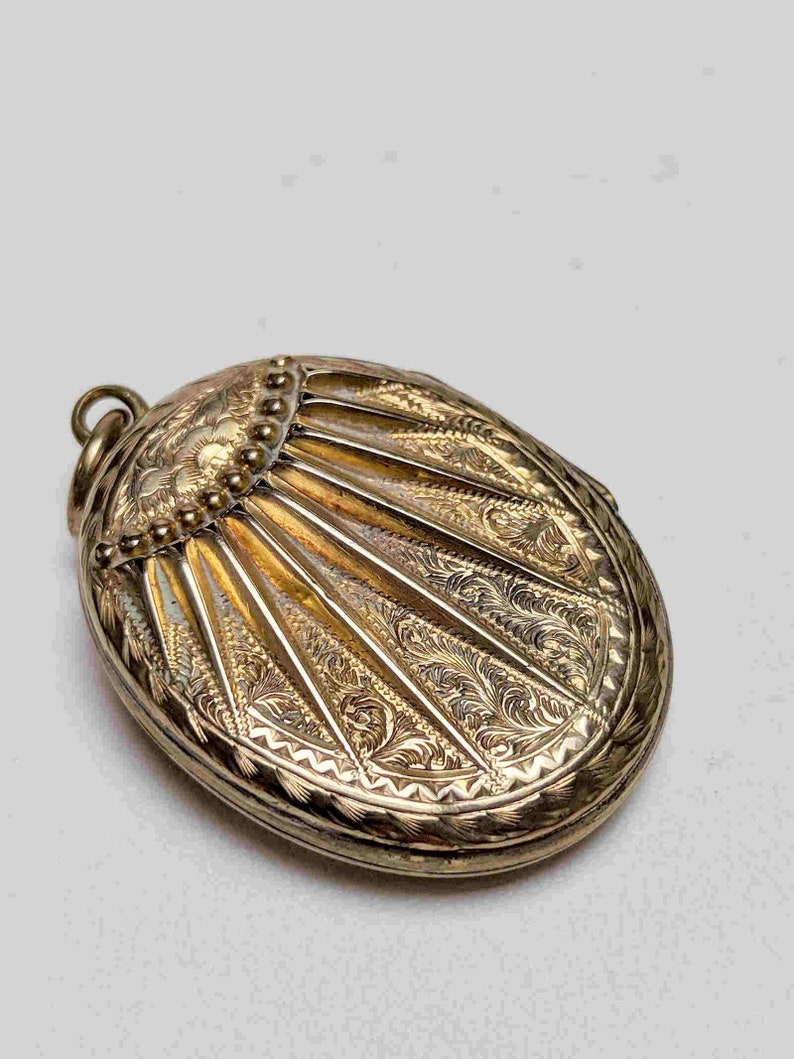 pattern on both sides Antique 9 carat gold sunburst locket