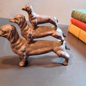 Cast iron doorstop, three dachshund dog figurines stacked on top of each other, Bookend
