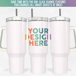 May include: Three white stainless steel travel mugs with handles and lids. The middle mug has the text "YOUR DESIGIL HERE" in colourful letters.