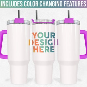 May include: Three white stainless steel tumblers with purple lids and handles. The middle tumbler has the text "YOUR DESIGN HERE" in colourful letters.