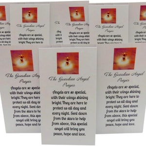 May include: A collection of white cards featuring the text "The Guardian Angel Prayer." Each card has a colorful image of an angel. The prayer text is printed in black, with a decorative font. The cards are arranged in a slightly overlapping pattern.