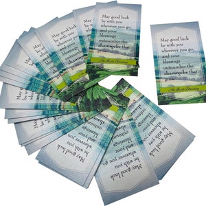 May include: A stack of blue and green cards with a shamrock design and the text "May good luck be with you wherever you go, and your blessings outnumber the shamrocks that grow. An Irish Blessing"