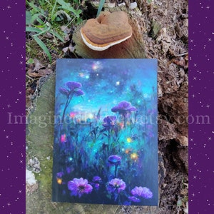 May include: A dark blue notebook with a colorful floral design. The cover features a field of purple flowers with a starry night sky in the background.