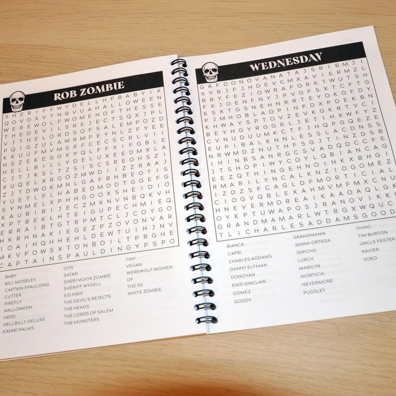 May include: A black and white word search puzzle featuring the name "Rob Zombie" and characters from his films. The puzzle includes words like "Halloween", "Captain Spaulding", "The Devil's Rejects", and "The Munsters".