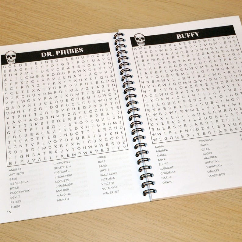 May include: A black and white word search puzzle book with a skull design on the cover. The book is open to a page with the title "Dr. Phibes" and a word search puzzle. The opposite page has the title "Buffy" and a word search puzzle.
