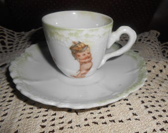 Juego de taza y platillo Rose O'Neill Soldier Kewpie (Demi-set)