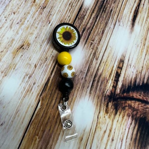 Sunflower badge reel