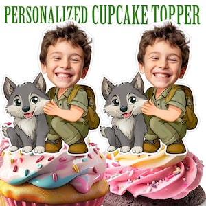 May include: Personalized cupcake topper featuring a cartoon boy with a wolf. The boy is wearing a green shirt and brown pants. The wolf is gray and has a white chest. The topper is perfect for a birthday party or other special occasion.
