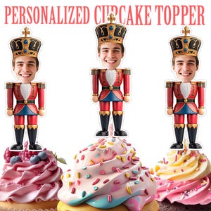 May include: Personalized cupcake toppers featuring a smiling face on a toy soldier design. The toppers are placed on top of cupcakes with colorful frosting and sprinkles. The text "PERSONALIZED CUPCAKE TOPPER" is at the top.