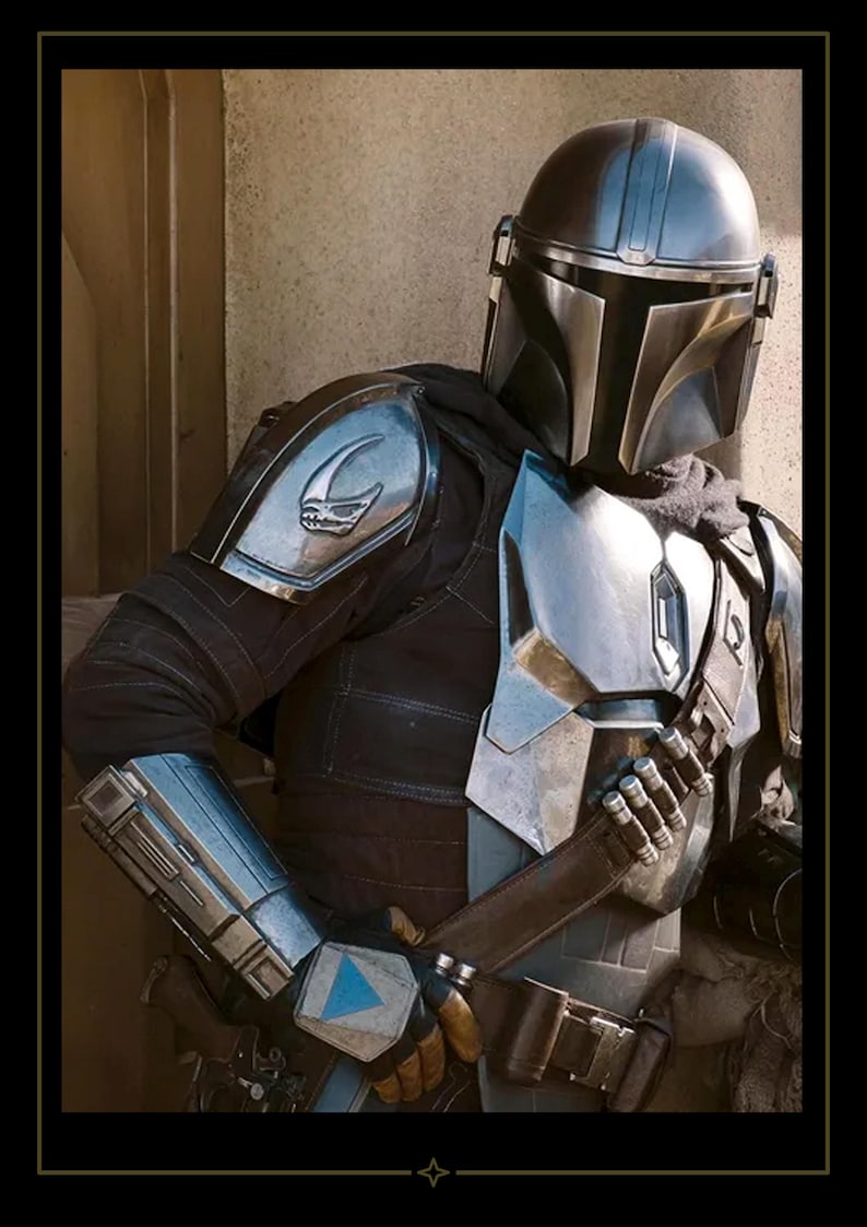May include: A full-body suit of metallic armor featuring a polished silver helmet with a T-shaped visor, a chest plate, shoulder pauldrons with a skull emblem, and gauntlets. The armor is worn over a dark fabric undersuit with a utility belt and bandolier.