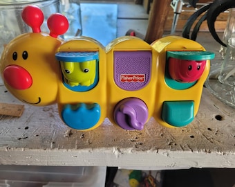 Fisher price caterpillar pop up sale