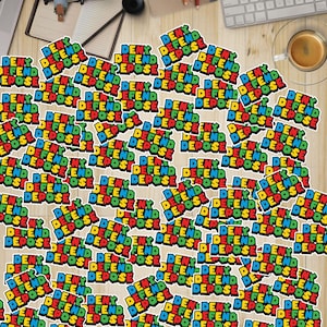 May include: A close-up of a collection of colorful stickers with the words "Deny" and "Depose" repeated in a pattern. The stickers are arranged in a random pattern on a wooden surface.