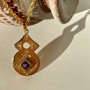 Tuareg gold plated pendant with amethyst or garnet stone in ethnic nomadic tribal shape. Bedouin African necklace. Saajie black owned shop image 3