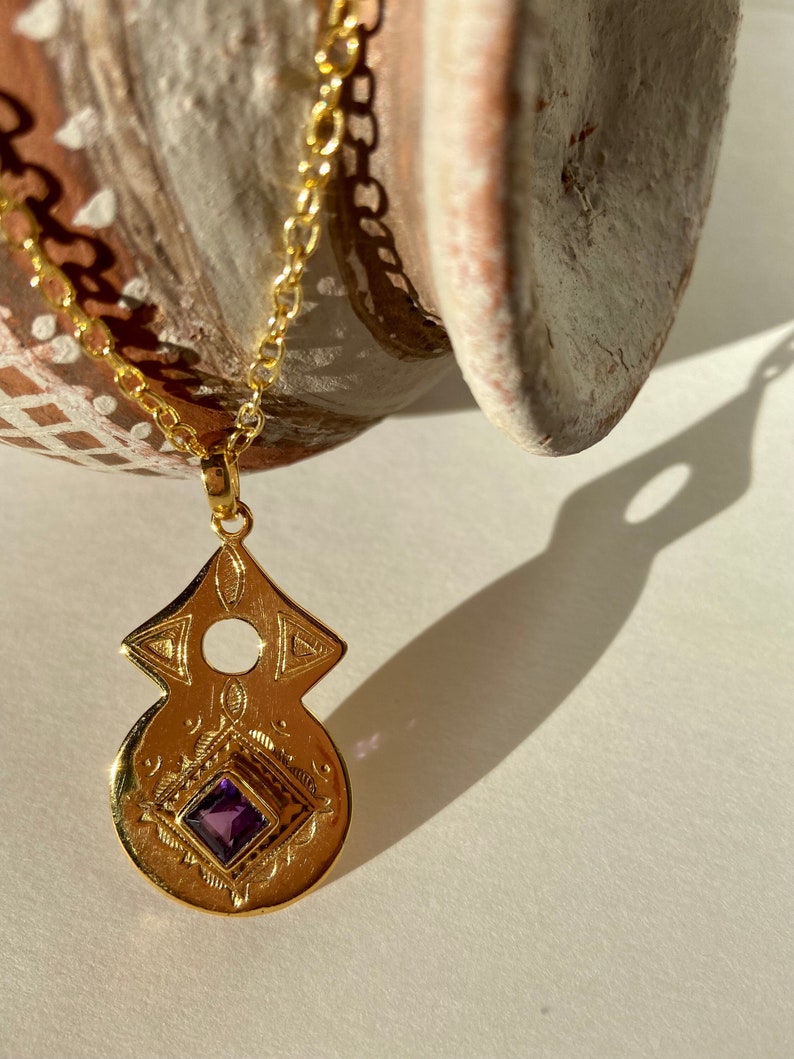 Tuareg gold plated pendant with amethyst or garnet stone in ethnic nomadic tribal shape. Bedouin African necklace. Saajie black owned shop image 3