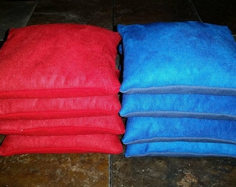 8 resin filled Stop and Go slick and stick all weather cornhole bags PRO style - red & blue duck/suede