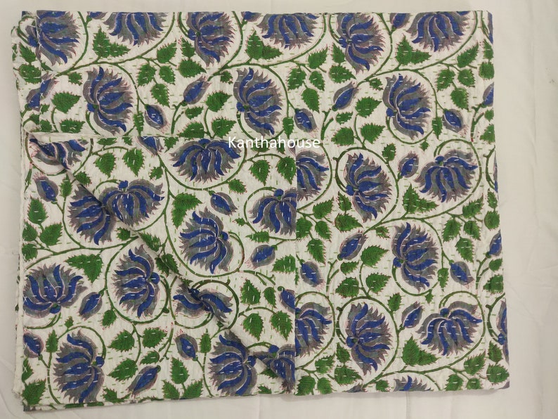 May include: White cotton kantha quilt with a floral pattern in shades of blue, green, and gray. The quilt is hand-stitched and has a traditional Indian design.