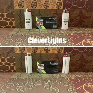 May include: White lighters with the text "YOUR IMAGE HERE" and a business card with the "CleverLights" logo. The lighters have a red ignition button. The background has a paisley pattern.