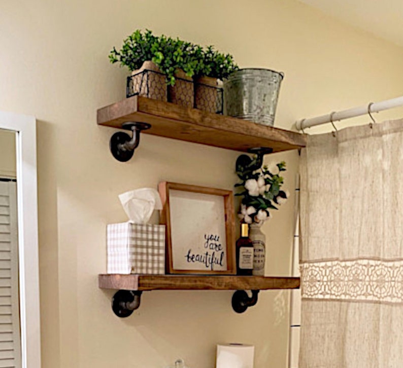 Rustic Heavy Duty Solid Pine Wood Floating shelves with Robust Angled Pipe Brackets.  Great for Bathrooms, Bedrooms, Laundry Room Storage, Kitchens, Study, anywhere you need polished farmhouse and industrial storage and organization.