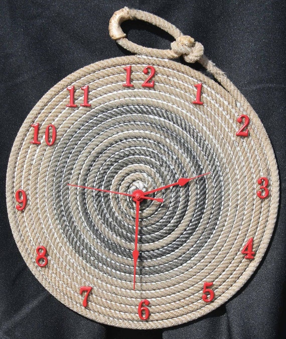 Rope clock, approx 12" to 14" round large sized clock . Clock is made with used cowboy nylon ropes. Clock face can be made any color.