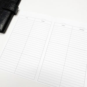 May include: A white planner with a black and white grid pattern. The planner has sections for notes, Monday, Tuesday, and Wednesday.