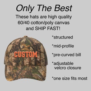 May include: A camouflage baseball cap with an orange "CUSTOM" embroidered on the front. The cap is structured, has a mid-profile, pre-curved bill, adjustable velcro closure, and is one size fits most.