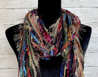 Fringe boho lightweight fashion scarf in shades of red, blue, gold, black, maroon and green.
