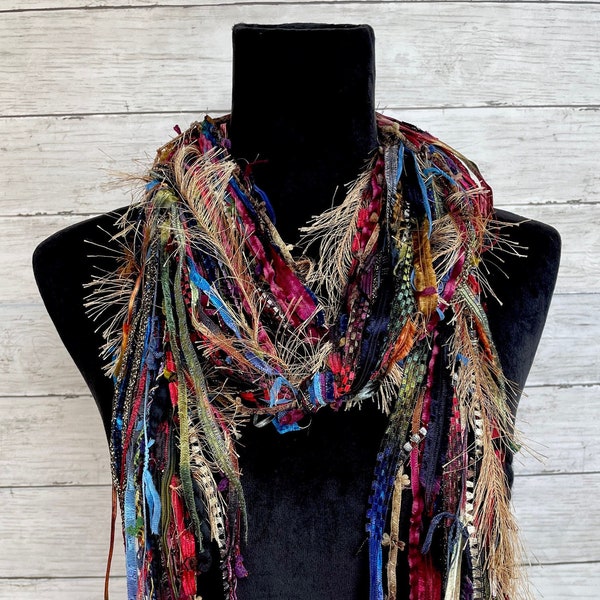 Fringe boho lightweight fashion scarf in shades of red, blue, gold, black, maroon and green.