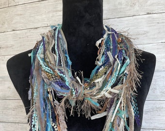 Womens unique, fun, lightweight boho scarf in shades of blue, green, purple, taupe, grey, copper and cream.