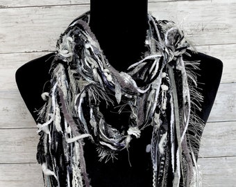 Womens unique, soft, versatile, lightweight boho fashion scarf in shades of black, white, grey and silver.