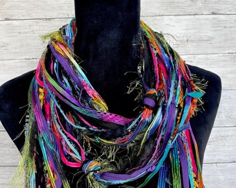 Women's scarf, fun, versatile, lightweight fashion scarf in vibrant shades of pink, purple, green, blue, yellow, orange, red and black.
