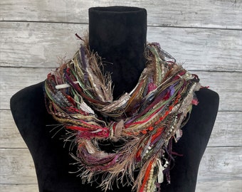 Womens unique, fun, lightweight boho fashion scarf in shades of red, green, tan, purple, orange, cream and taupe.