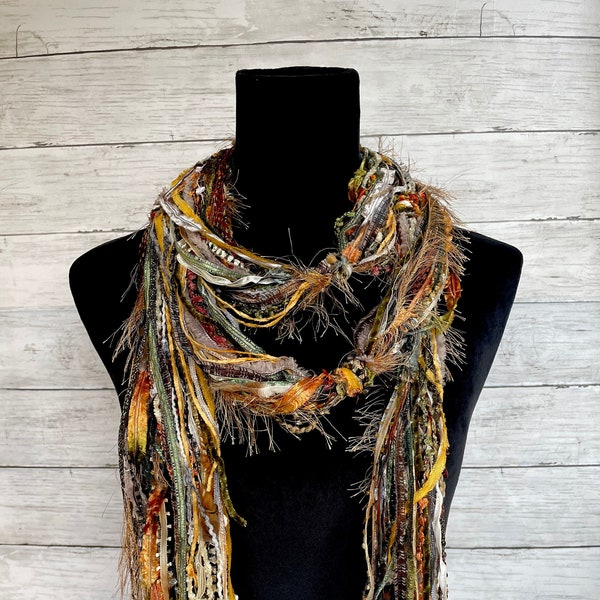 Womens unique, versatile, lightweight boho  scarf in shades of brown, green, orange, tan, cream, taupe and burgundy.