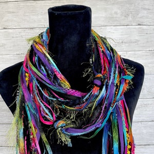 Women's scarf, fun, versatile, lightweight fashion scarf in vibrant shades of pink, purple, green, blue, yellow, orange, red and black.
