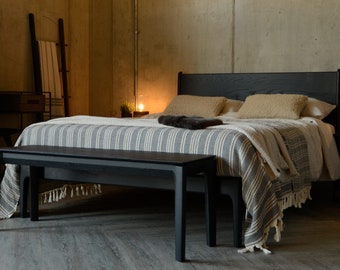 Beautiful, sturdy wooden bed. Handcrafted with shaped legs and soft curves at the edges