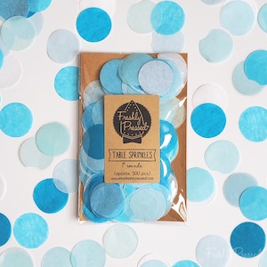 May include: A package of blue and white tissue paper confetti circles, approximately 500 pieces, labeled "Freshly Pressed Table Sprinkles 1" rounds"