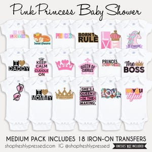 May include: A collection of eighteen white baby bodysuits featuring various iron-on transfers with pink, gold, and black graphics including crowns, hearts, unicorns, and text such as I AM LOVED, BORN TO RULE, QUEEN OF CUDDLES, and THE BOSS.