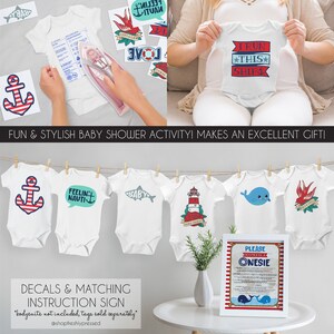 May include: A set of nautical themed iron-on decals for baby onesies. The decals feature anchors, lighthouses, whales, and other nautical designs. The set also includes an instruction sign with the text "Please Decorate a Onesie".