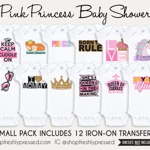 May include: A collection of twelve white baby bodysuits featuring various iron-on transfers with pink, gold, and black graphics. Designs include crowns, a fox, sunglasses, and text such as Keep Calm and Cuddle On, Born to Rule, and Queen of Cuddles.