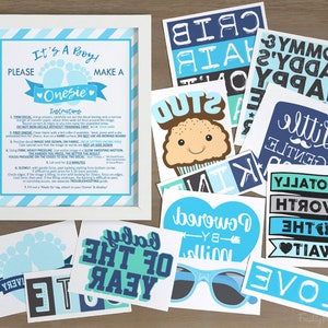 K&ouml;nnte beinhalten: Ein Set aus blauen und wei&szlig;en Babyparty-Dekorationen mit dem Text "Es ist ein Junge!" und "Mach ein Strampler". Die Dekorationen beinhalten ein gerahmtes Schild mit Anweisungen, einen Cupcake mit einem fr&ouml;hlichen Gesicht und verschiedene andere Designs mit S&auml;tzen wie "Absolut die Wartezeit wert" und "Angetrieben von Milch".