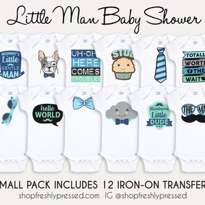 May include: Twelve iron-on transfers for baby onesies featuring various designs, including a dog wearing glasses, a cupcake, a tie, sunglasses, a speech bubble with the words "hello world", a bow tie, a cloud with a bow tie, a shield with the words "handsome little dude", and a mustache with sunglasses. The text "Small Pack Includes 12 Iron-On Transfers" is at the bottom of the image.