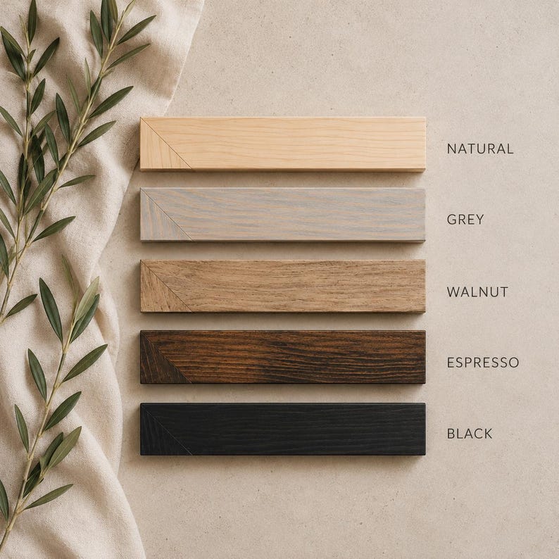 May include: Five rectangular wooden frame strips arranged vertically, featuring distinct finishes labelled as Natural, Grey, Walnut, Espresso, and Black. Each strip displays a visible wood grain texture and a mitered corner detail on the left side.