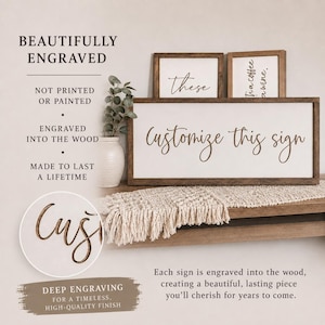 May include: A rectangular wooden sign with a white background and dark brown frame featuring the engraved text "Customize this sign". Additional smaller signs are visible in the background with text "these" and "a coffee a wine".