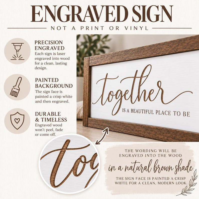 May include: A rectangular wooden sign with a dark brown frame and a white face. The text "together IS A BEAUTIFUL PLACE TO BE" is laser engraved into the wood in a natural brown shade. The sign features a clean, modern aesthetic.