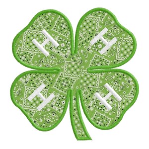 May include: Green four-leaf clover with a white "H" in each leaf. The clover is made of a green fabric with a paisley pattern.