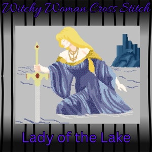 May include: Cross-stitch design featuring a woman in a blue gown holding a sword, with the text "Witchy Woman Cross Stitch" and "Lady of the Lake". The woman has blonde hair and is kneeling. The background is gray with a blue structure.