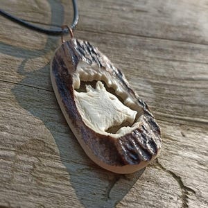 A hand-carved wild boar necklace or a keychain - a special gift for a pig hunter!
