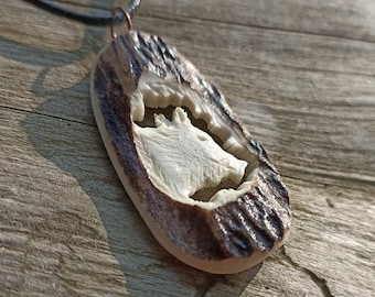 A hand-carved wild boar necklace or a keychain - a special gift for a pig hunter!